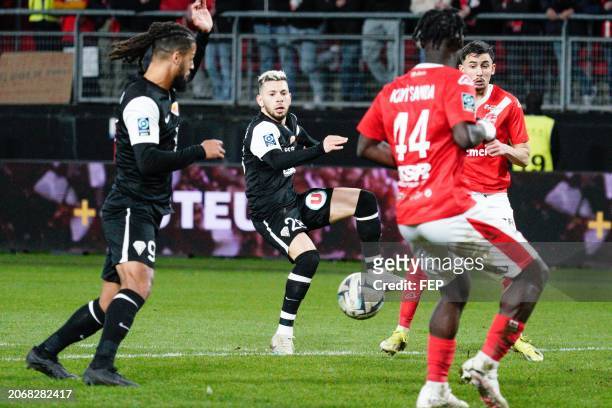 Farid El Melali of Angers sees his shot blocked during the Ligue 2 BKT match between Valenciennes and Angers at Stade du Hainaut on March 9, 2024 in...