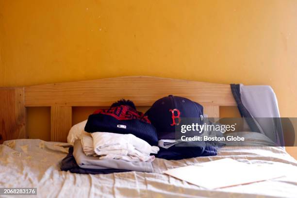 Santo Domingo, DR Boston Red Sox gear on the bunk bed of one of the pitchers in Diofante de Peña's program. Red Sox pitcher Brayan Bello lived in the...