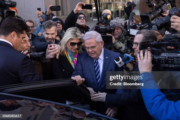 Senator Robert Menendez, a Democrat from New Jersey, center right, and Nadine Menendez, wife of Senator Robert Menendez, center left, depart federal...