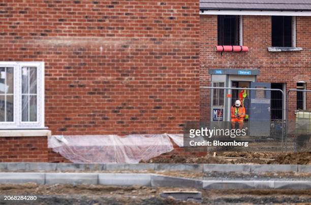 Worker in a security hut at a Persimmon Plc residential property construction site in Braintree, UK, on Monday, March 11, 2024. Persimmon are due...