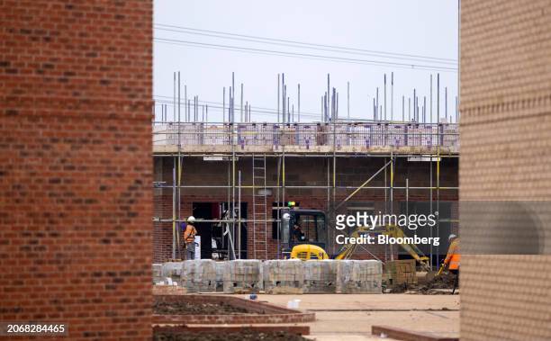 Workers build new homes at a Persimmon Plc residential property construction site in Braintree, UK, on Monday, March 11, 2024. Persimmon are due...