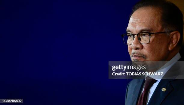 Malaysian Prime Minister Anwar Ibrahim looks on during a joint press conference following talks with the German chancellor at the Chancellery in...