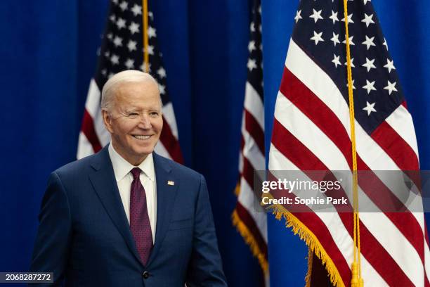 President Joe Biden walks on stage during an event about lowering costs for American families at the Granite State YMCA Allard Center of Goffstown on...