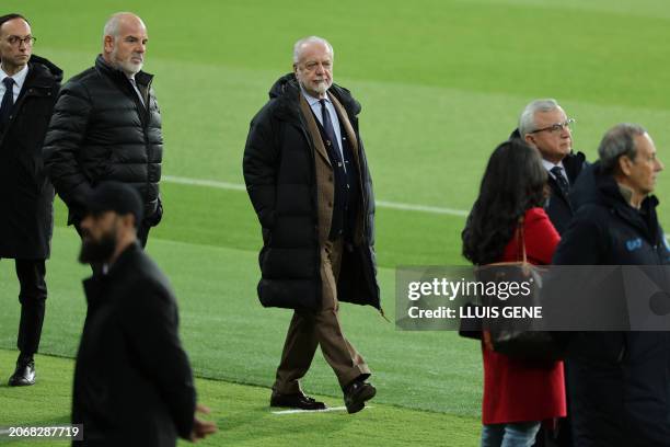 Napoli's Italian president Aurelio De Laurentiis attends a pitch inspection before a press conference on the eve of their UEFA Champions League last...
