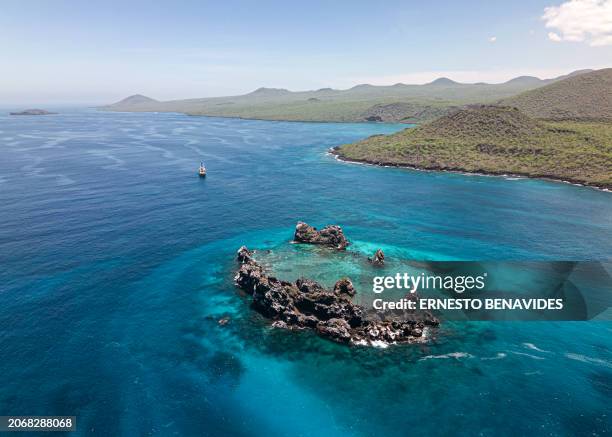 Aerial view of the ship Arctic Sunrise sailing during a scientific expedition by Greenpeace near La Corona del Diablo in the Galapagos archipelago,...