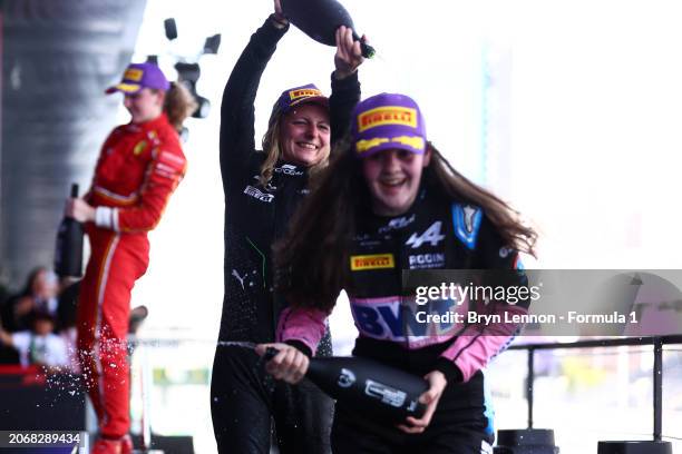 Race winner Doriane Pin of France and PREMA Racing and Second placed Abbi Pulling of Great Britain and Rodin Motorsport celebrate on the podium...