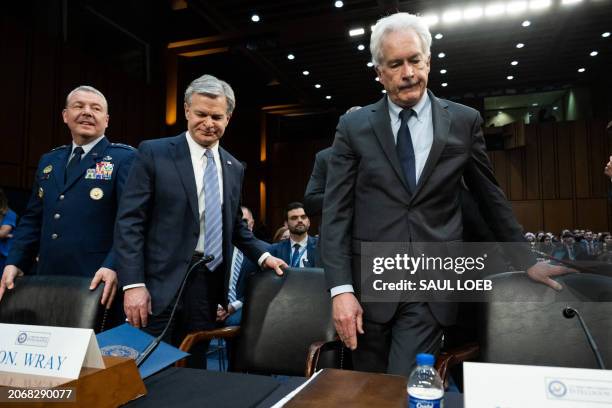 Director of the Defense Intelligence Agency Lieutenant General Jeffrey Kruse , FBI Director Christopher Wray and CIA Director William Burns arrive to...