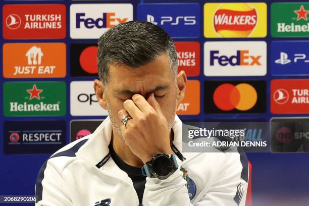 Porto's Portuguese coach Sergio Conceicao gestures during a press conference on the eve of the UEFA Champions Leauge round of 16 second leg football...