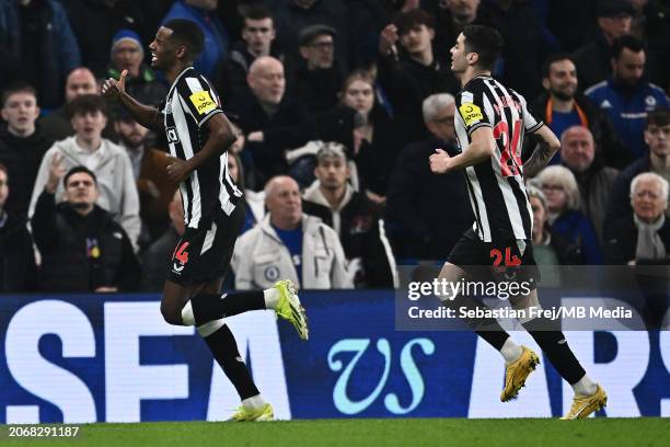 Alexander Isak of Newcastle United celebrates with Miguel Almiron after scoring a goal during the Premier League match between Chelsea FC and...