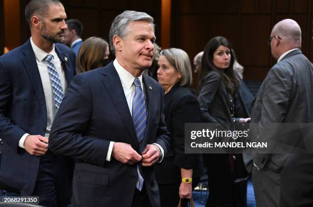 Director Christopher Wray departs after testifying during a Senate Select Committee on Intelligence on the "Annual Worldwide Threats Assessment" in...