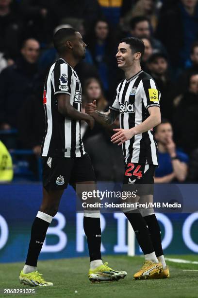 Alexander Isak of Newcastle United celebrates with Miguel Almiron after scoring a goal during the Premier League match between Chelsea FC and...