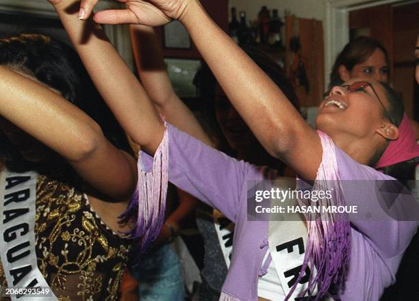 Sonia Rolland, Miss France 2000, belly dances with Miss Uruguay 2000, Giovanna Piazza, at a Lebanese restaurant in Nicosia, Cyprus late 04 May 2000....