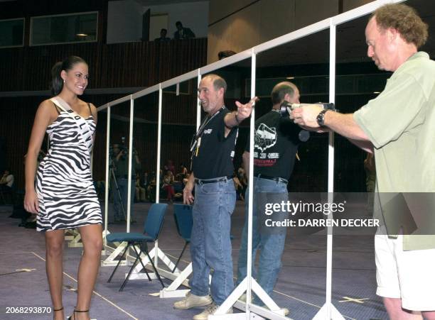 Yenny Vaca Paz, Miss Bolivia 2000, takes direction from stage manager Ken Stein , and assistant director Gregg Gelfand during a rehearsal 06 May 2000...