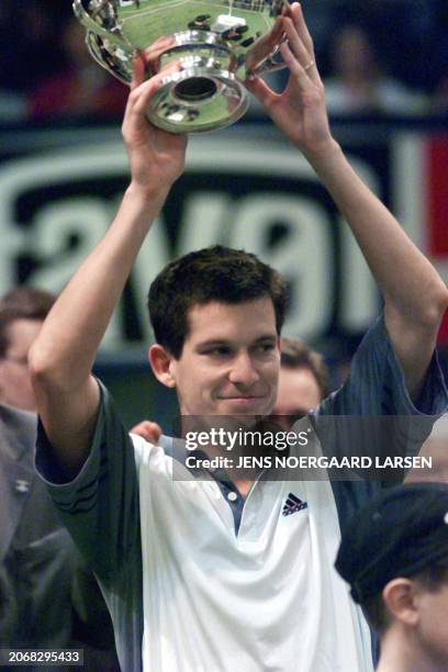 Britain's Tim Henman lifts the trophy after his victory against Andreas Vinciguerra from Sweden in the ATP-tournament Copenhagen Open 18 February...