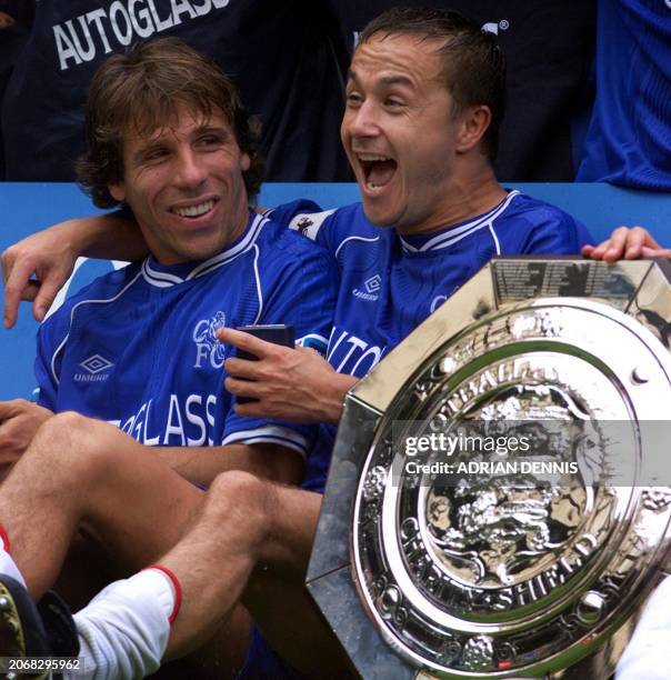 Chelsea's captain Dennis Wise laughs with team mate Gianfranco Zola after winning the F.A Charity Shield at Wembley stadium in London 13 August 2000....