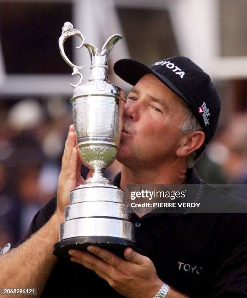 American Mark O`Meara kisses the Open Golf Championship Cup, 19 July, after beating his compatriot Brian Watts in a play off at Royal Birkdale.