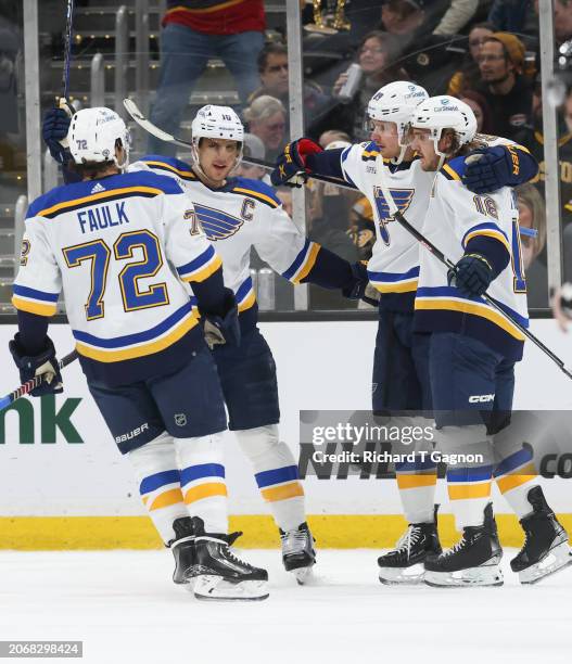 Robert Thomas of the St. Louis Blues celebrates his goal against the Boston Bruins during the first period with his teammates Justin Faulk, Brayden...