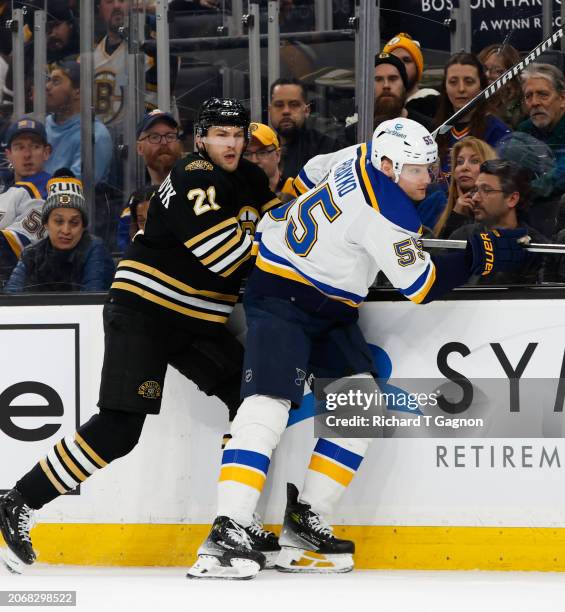 James van Riemsdyk of the Boston Bruins checks Colton Parayko of the St. Louis Blues during the first period at the TD Garden on March 11, 2024 in...