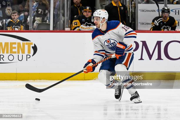 Edmonton Oilers left wing Zach Hyman skates with the puck during the third period in the NHL game between the Pittsburgh Penguins and the Edmonton...