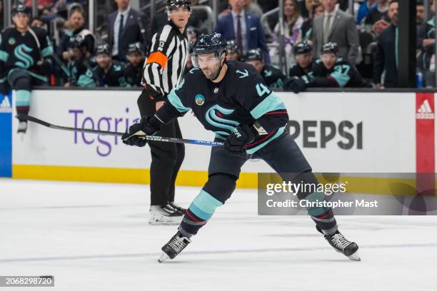 Justin Schultz of the Seattle Kraken shoots the puck on goal during the first period of a game against the Winnipeg Jets at Climate Pledge Arena on...