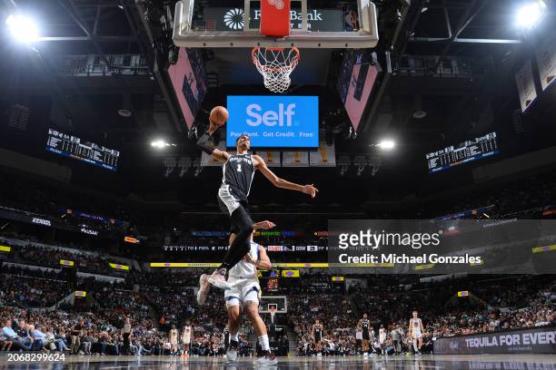 Victor Wembanyama of the San Antonio Spurs drives to the basket during the game against the Golden State Warriors on March 11, 2024 at the Frost Bank...