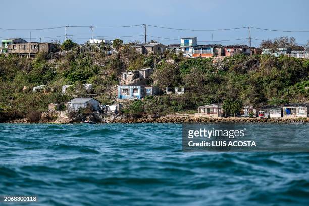 View of houses affected by sea level rise in Tierra Bomba Island, Cartagena, Colombia, taken on February 24, 2024. Every year the sea level rises and...