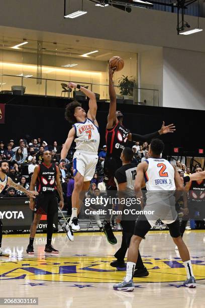 Isaiah Roby of the Westchester Knicks and Scotty Pippen of the South Bay Lakers go up for the opening tip off on March 11, 2024 at UCLA Health...