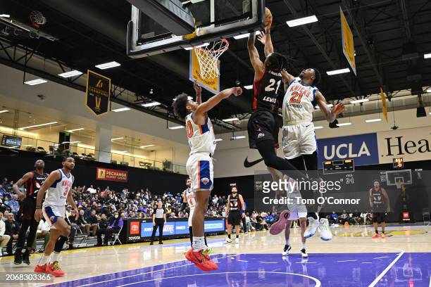 Vincent Valerio-Bodon of the South Bay Lakers drives to the basket during the game as Mamadi Diakite of the Westchester Knicks plays defense on March...