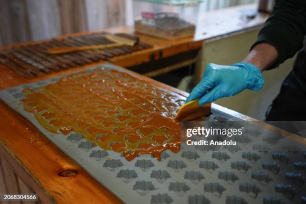 Freshly made maple sugar candies are seen at the Maple Town of the Mountsberg Conservation Area near Campbellville, Ontario on March 11, 2024....