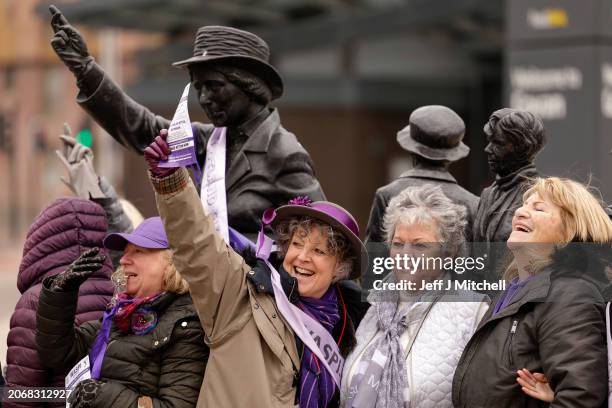 Women gather at the statue of political activist Mary Barbour in Govan, to mark International Women’s Day on March 08, 2024 in Glasgow, Scotland. The...