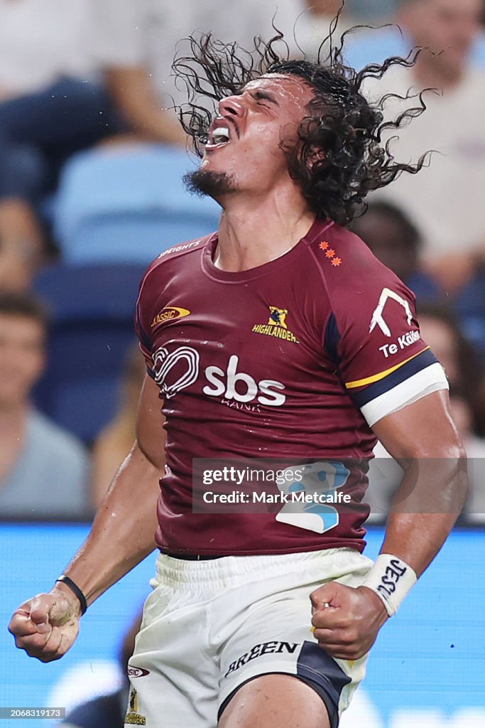 Rob Tanielu Tanielu Tele’a of the Highlanders celebrates scoring a try during the ...