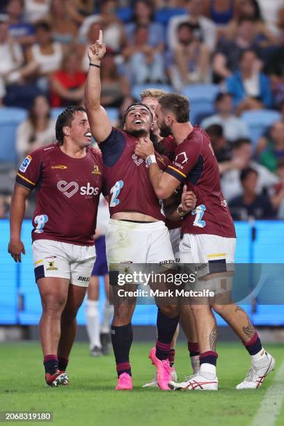 Tanielu Tele’a of the Highlanders celebrates scoring a try during the round three Super Rugby Pacific match between NSW Waratahs and Highlanders at...