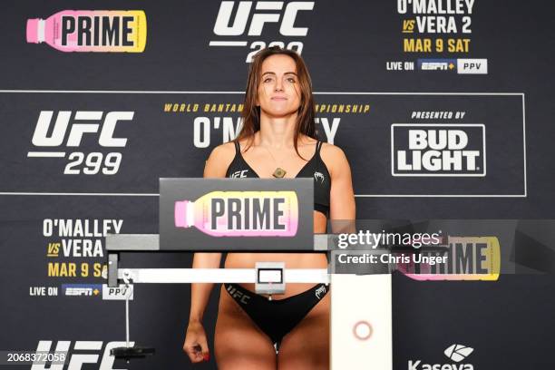 Maycee Barber poses on the scale during the UFC 299 official weigh-in at the Marriott Miami Biscayne Bay on March 08, 2024 in Miami, Florida.