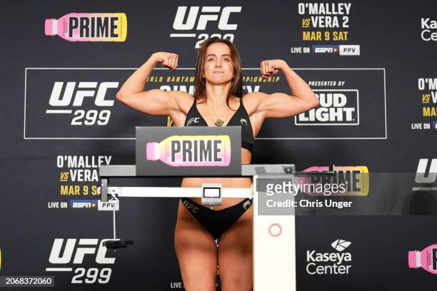 Maycee Barber poses on the scale during the UFC 299 official weigh-in at the Marriott Miami Biscayne Bay on March 08, 2024 in Miami, Florida.