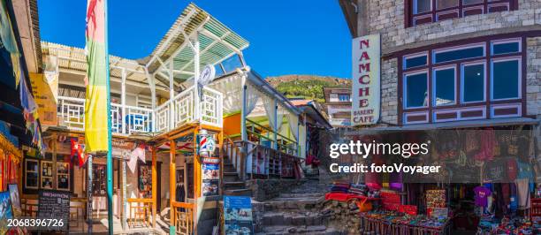 nepal namche bazaar colorful shops bakeries and teahouses street panorama - namche bazaar stock pictures, royalty-free photos & images