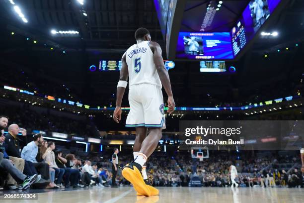 Anthony Edwards of the Minnesota Timberwolves walks across the court in the fourth quarter against the Indiana Pacers at Gainbridge Fieldhouse on...