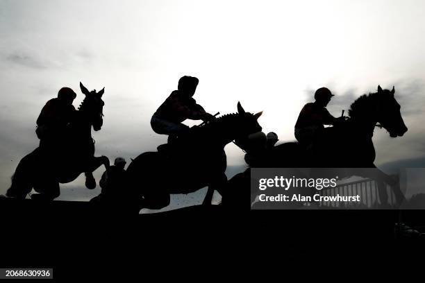 Over a flight of hurdles during The Brett Martin Novices' Handicap Hurdle at Exeter Racecourse on March 08, 2024 in Exeter, England.