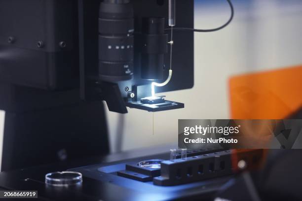 An instrument associated with a fully automated single-cell proteome analysis platform is being pictured in the laboratory of Hangzhou International...