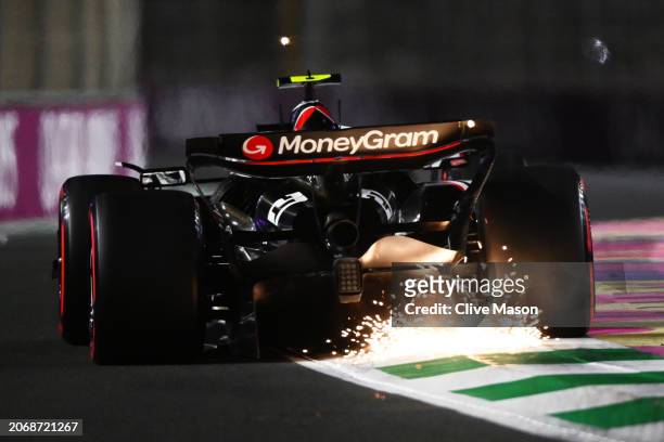 Sparks fly behind Nico Hulkenberg of Germany driving the Haas F1 VF-24 Ferrari on track during qualifying ahead of the F1 Grand Prix of Saudi Arabia...