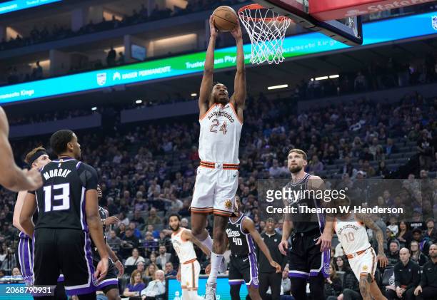 Devin Vassell of the San Antonio Spurs slam dunks against the Sacramento Kings during the first quarter of an NBA basketball game at Golden 1 Center...