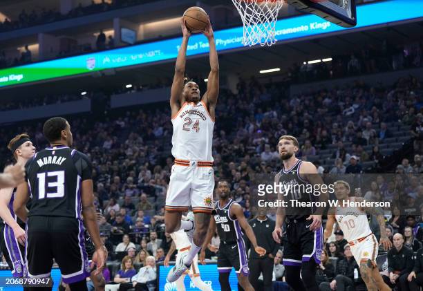 Devin Vassell of the San Antonio Spurs slam dunks against the Sacramento Kings during the first quarter of an NBA basketball game at Golden 1 Center...