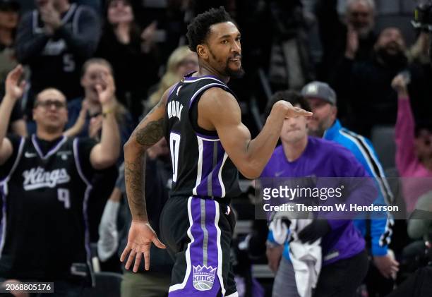 Malik Monk of the Sacramento Kings reacts after making a three-point shot to tie the game against the San Antonio Spurs late in fourth quarter of an...