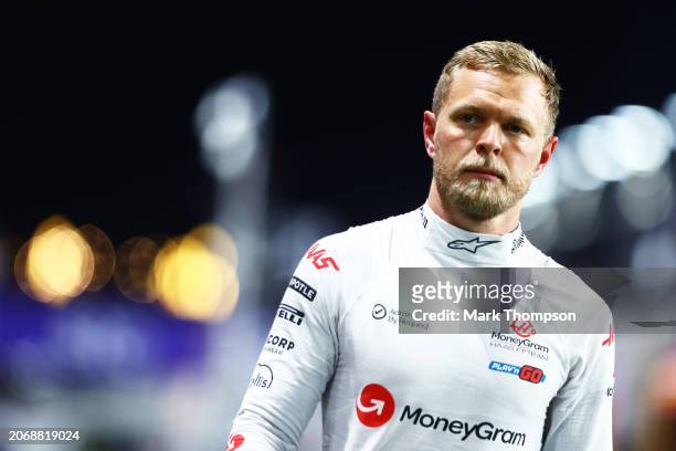 13th placed qualifier Kevin Magnussen of Denmark and Haas F1 walks in the Pitlane during qualifying ahead of the F1 Grand Prix of Saudi Arabia at...