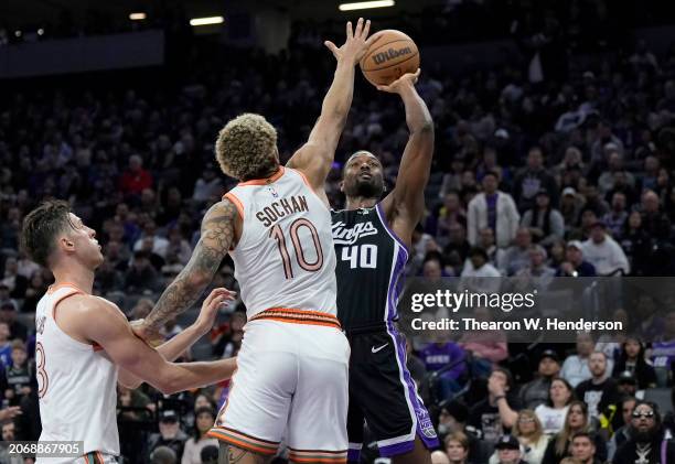 Harrison Barnes of the Sacramento Kings shoots over Jeremy Sochan of the San Antonio Spurs during the fourth quarter of an NBA basketball game at...