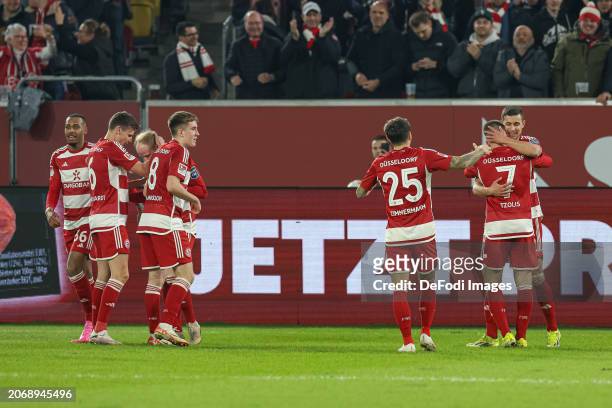 Christos Tzolis of Fortuna Duesseldorf celebrates after scoring his team's second goal with teammates during the Second Bundesliga match between...
