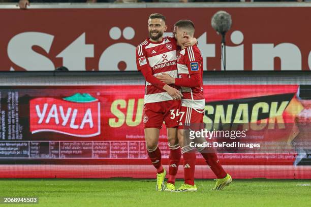 Christos Tzolis of Fortuna Duesseldorf celebrates after scoring his team's second goal with teammates during the Second Bundesliga match between...