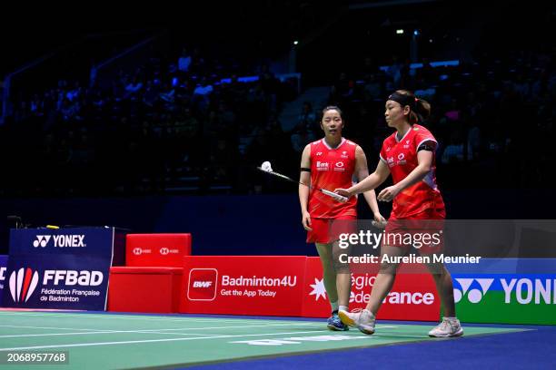 Chen Qing Chen and Jia Yi Fan of China react during their Women's double quarter final match against Gayatri Gopichand Pullela and Treesa Jolly of...