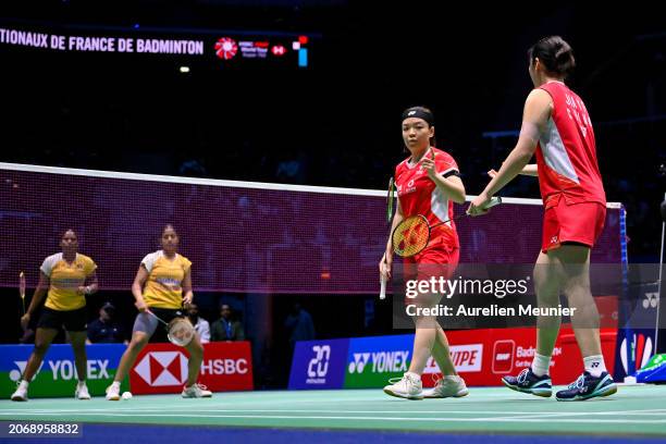 Chen Qing Chen and Jia Yi Fan of China react during their Women's double quarter final match against Gayatri Gopichand Pullela and Treesa Jolly of...