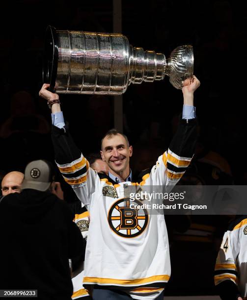 Zdeno Chara, a former Boston Bruin captain and player and member of the 2011 Stanley Cup champion team raises the Stanley Cup as he takes part in an...