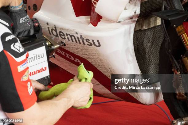 The mechanics of Takaaki Nakagami of Japan and IDEMITSU Honda LCR cleans the bile in box during the MotoGP Of Qatar - Free Practice at Losail Circuit...